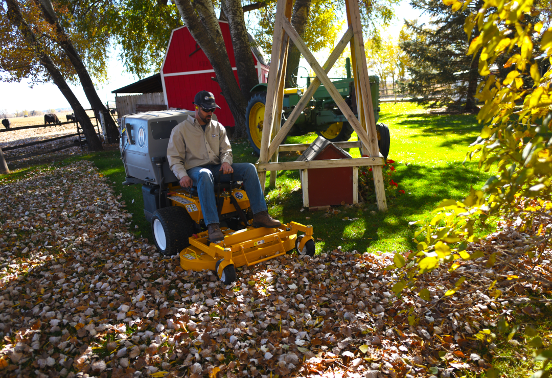 A Walker T27i mower collecting leaves